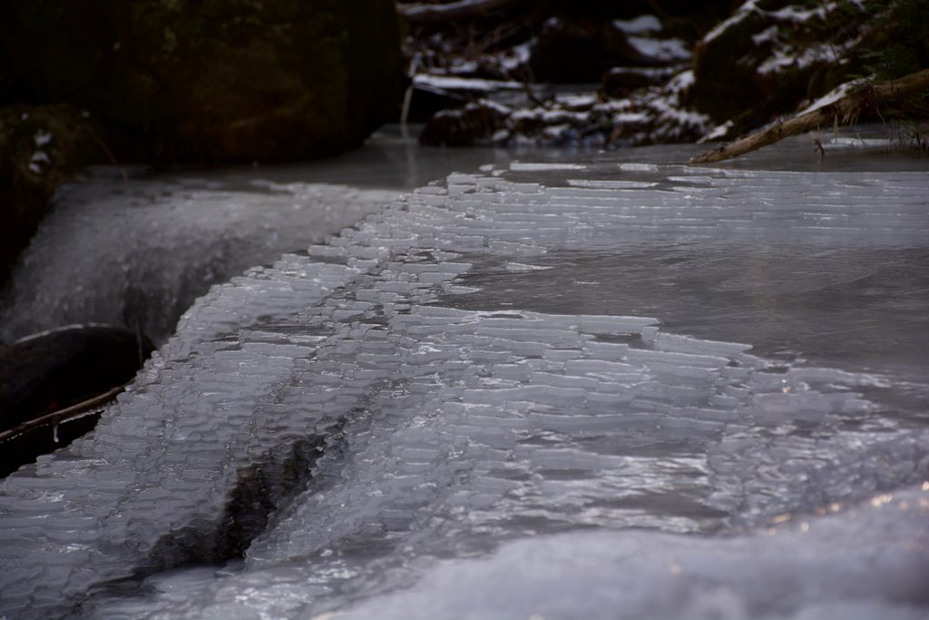 A photo of patchy digital ice over a stream